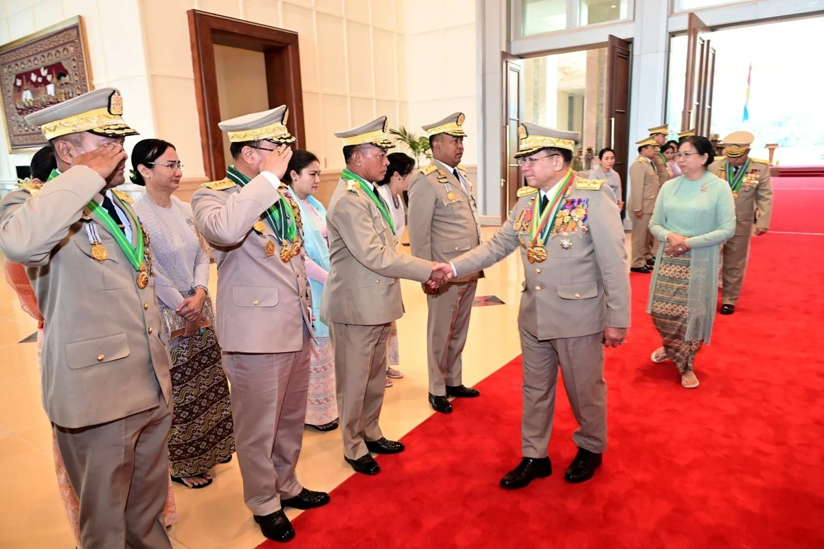 Outgoing Myanmar Commander-in-Chief Senior General Min Aung Hlaing greets leaders during a handover ceremony in Naypyidaw. (EPA)