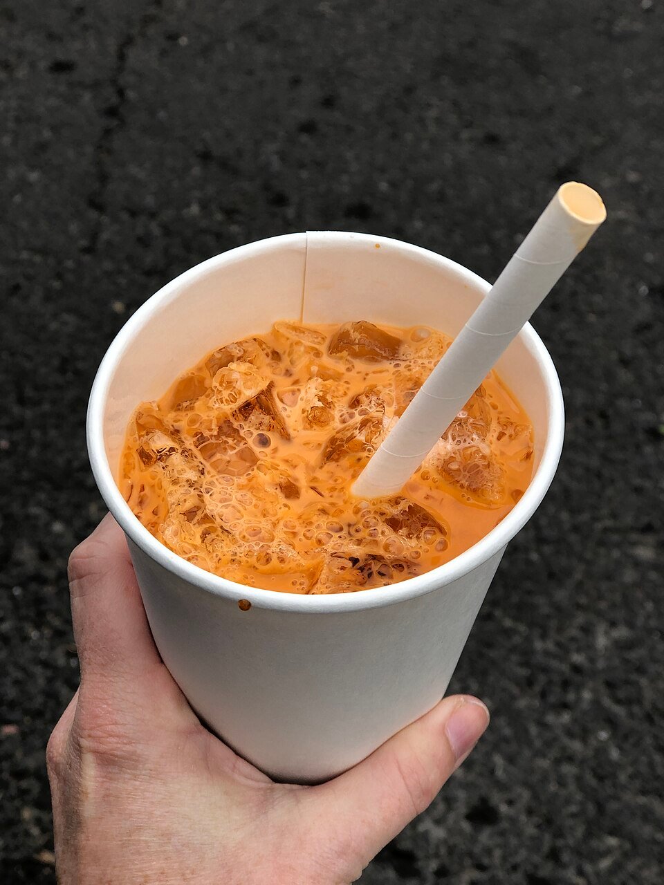 Illustration of Thai iced tea in a paper cup. (Wikimedia)