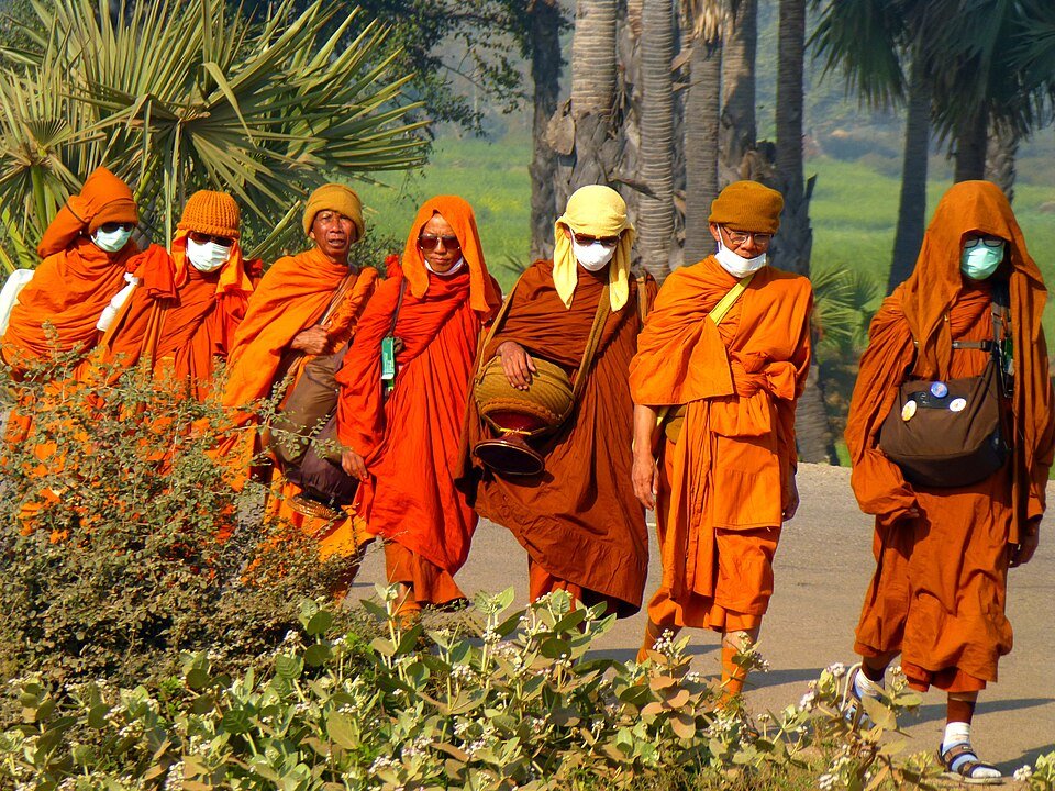 Illustration of monks walking to celebrate Vesak. (Anandajoti via Wikimedia)