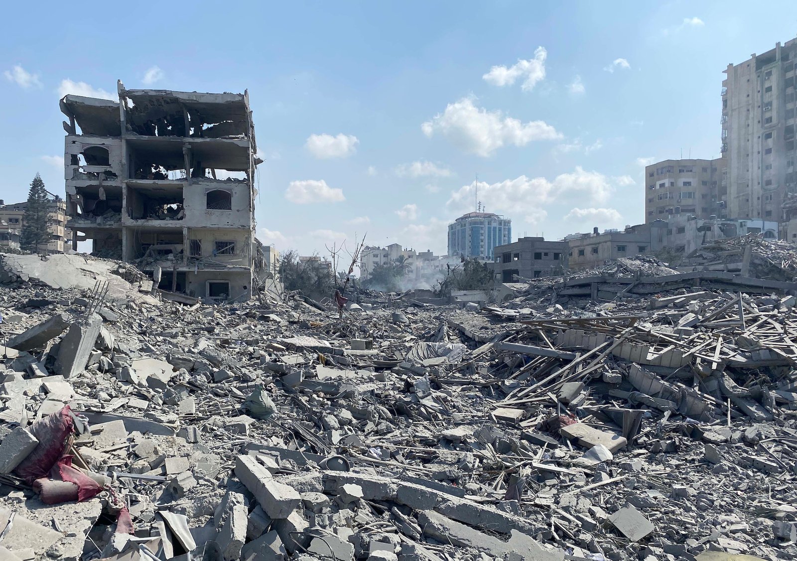 Residential buildings damaged in Gaza City’s Rimal neighborhood following an Israeli airstrike, October 9, 2023. (Palestinian News Agency)