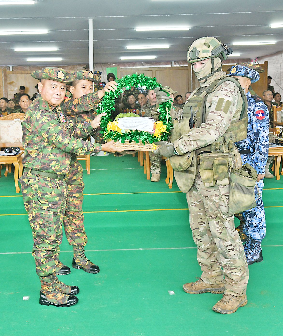 Myanmar and Russian military personnel exchange commemorative gifts during the closing ceremony of the joint military exercise Tiger-2026 in Nay Pyi Taw on July 17 2026. (Office of the Commander-In-Chief of Defense Services)