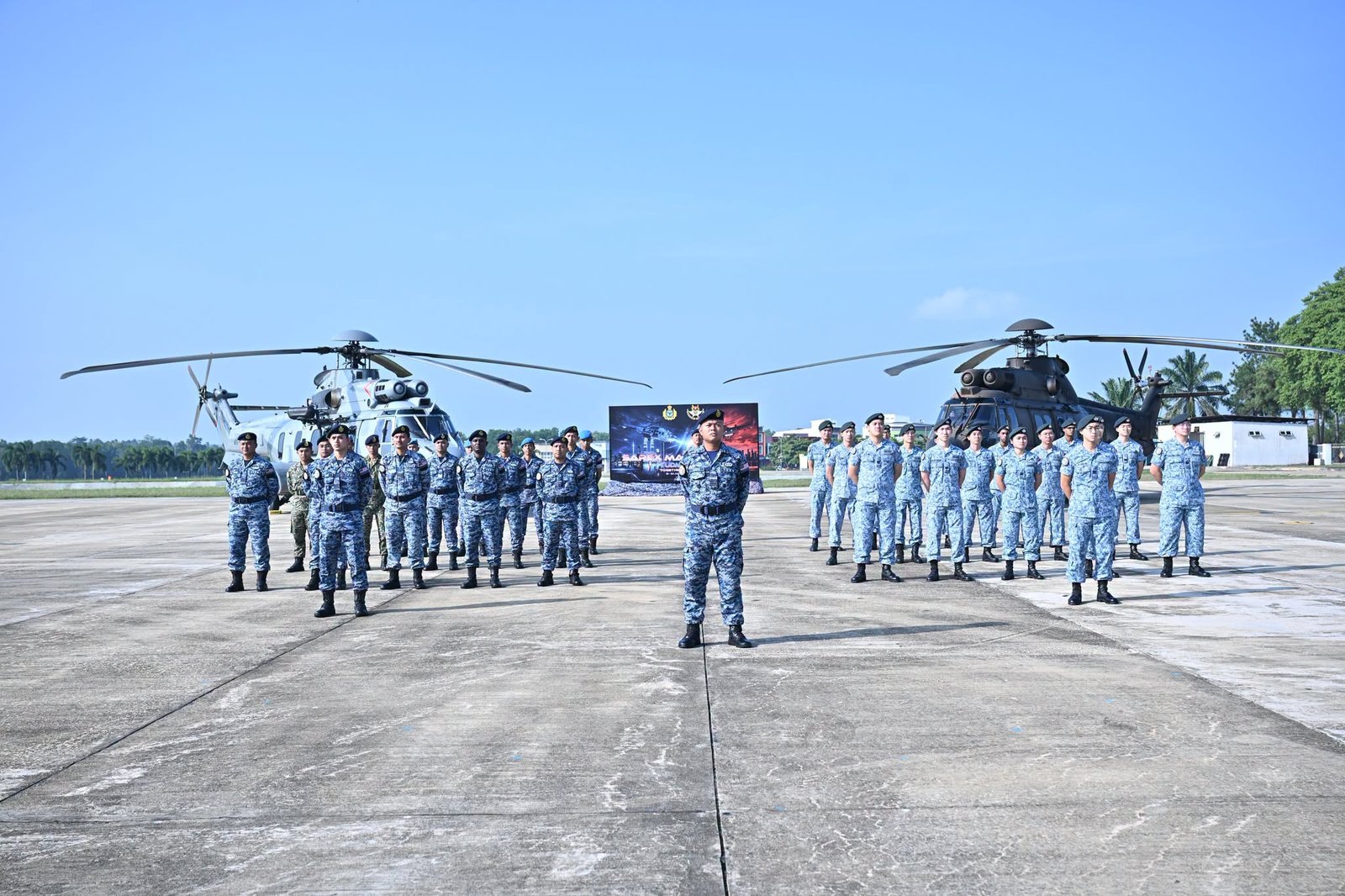RSAF and RMAF personnel stand alongside H225M and EC725 helicopters during the 8th SAREX MALSING at Kuantan Air Base, Malaysia. (Tentera Udara Diraja Malaysia)