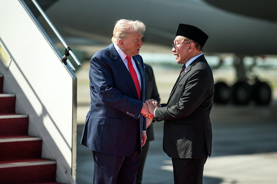 US President Donald Trump greets Malaysian Prime Minister Anwar Ibrahim during a meeting in Kuala Lumpur. (Wikimedia/The White House)