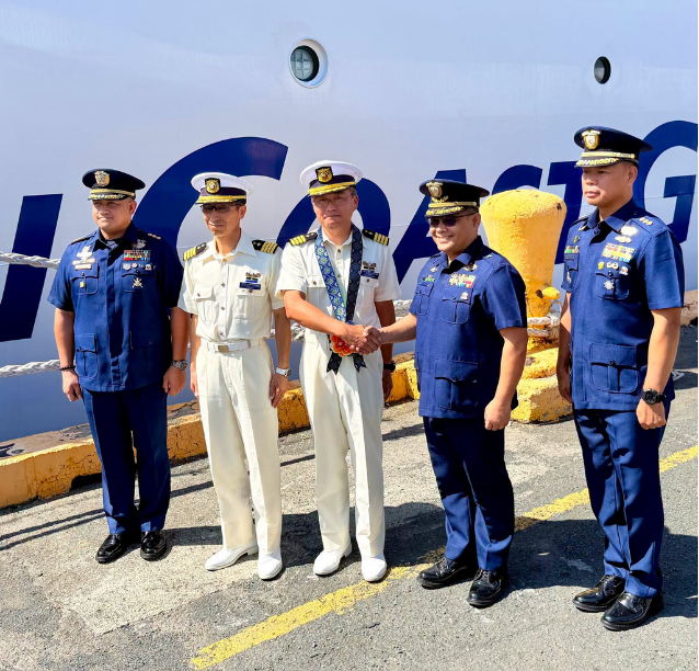 Philippine Coast Guard officials welcome Commander Naoki Mizoguchi and officers of the Japan Coast Guard training vessel Itsukushima (PL-23) during the vessel's arrival at the Port of Manila on 16 July 2026. (People’s Television)