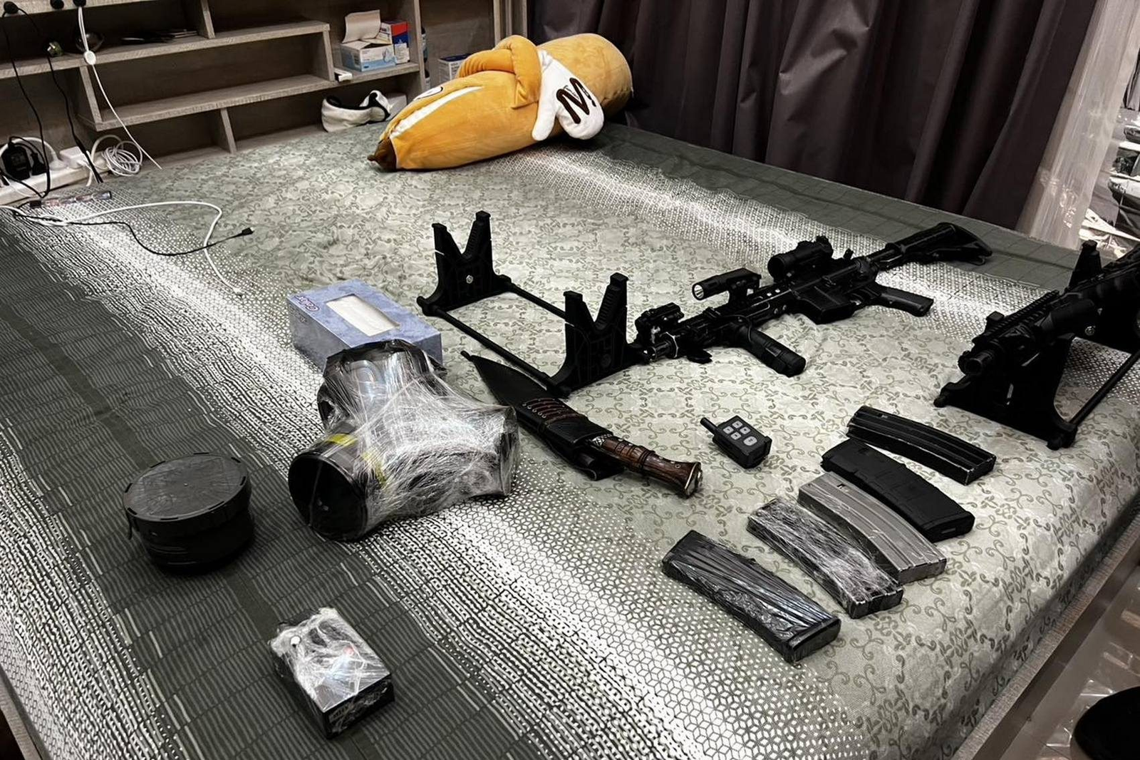 A photo published by Thai police on May 8, 2026, shows weapons found at a home near the beach resort of Pattaya. (Facebook/ThaiPoliceOfficial)